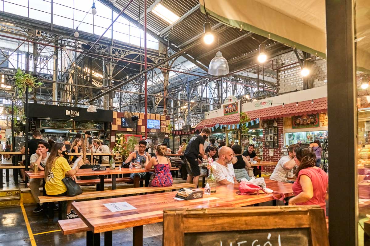 People eat inside the San Telmo Market in Buenos Aires