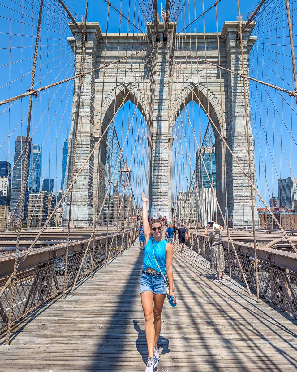 bailey walks along the Brooklyn Bridge in New York City