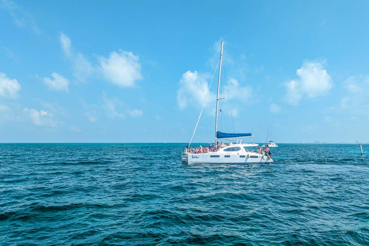 A catamaran in the beautiful waters off the coast of Tulum, Mexico