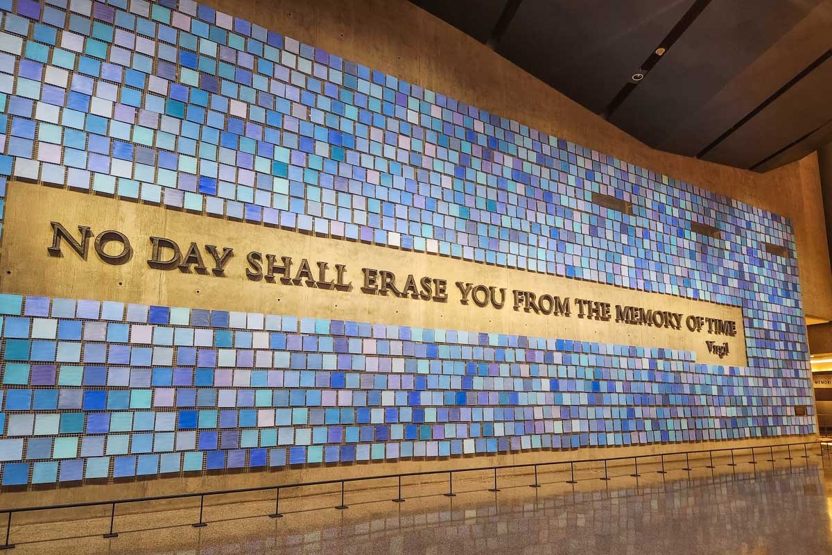 A huge wall inside the 911 museum that says No Day Shall Erase you from the memory of time in New York City