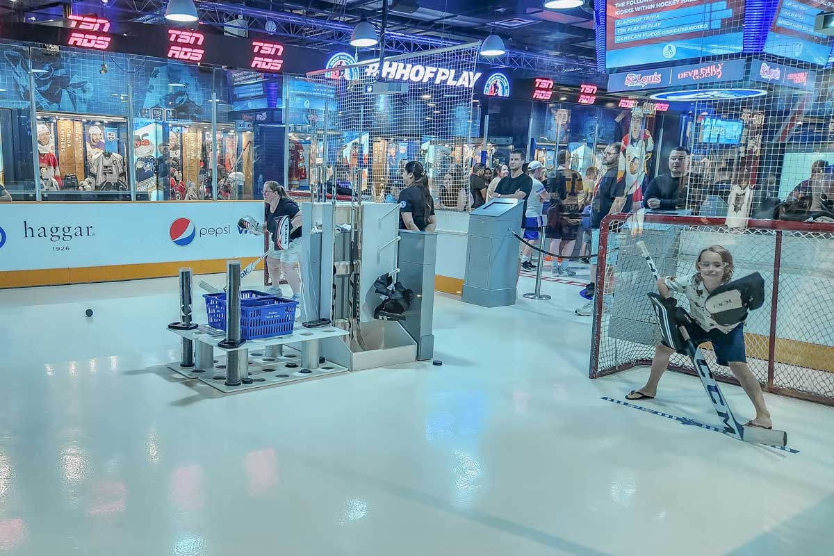 A kid in hockey goaly gear plays Pepsi Zero Sugar Shut Out at the Toronto Hockey Hall of Fame in Canada