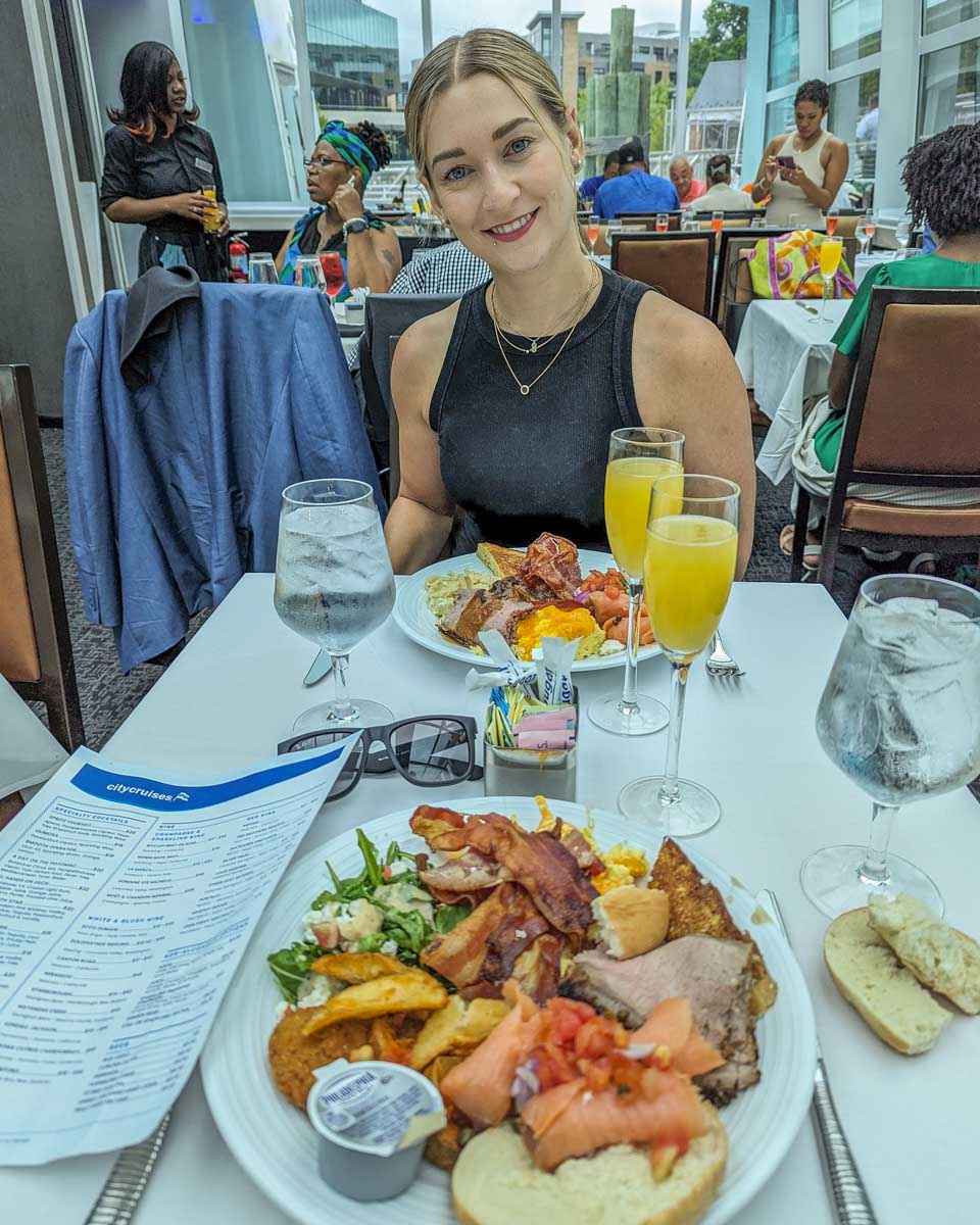 Bailey poses for a photo with her food on a brunch cruise in Washington DC