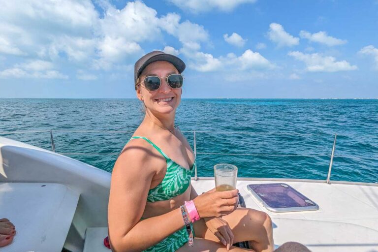 Bailey relaxes with a drink on a catamaran cruise from Playa del Carmen, Mexico
