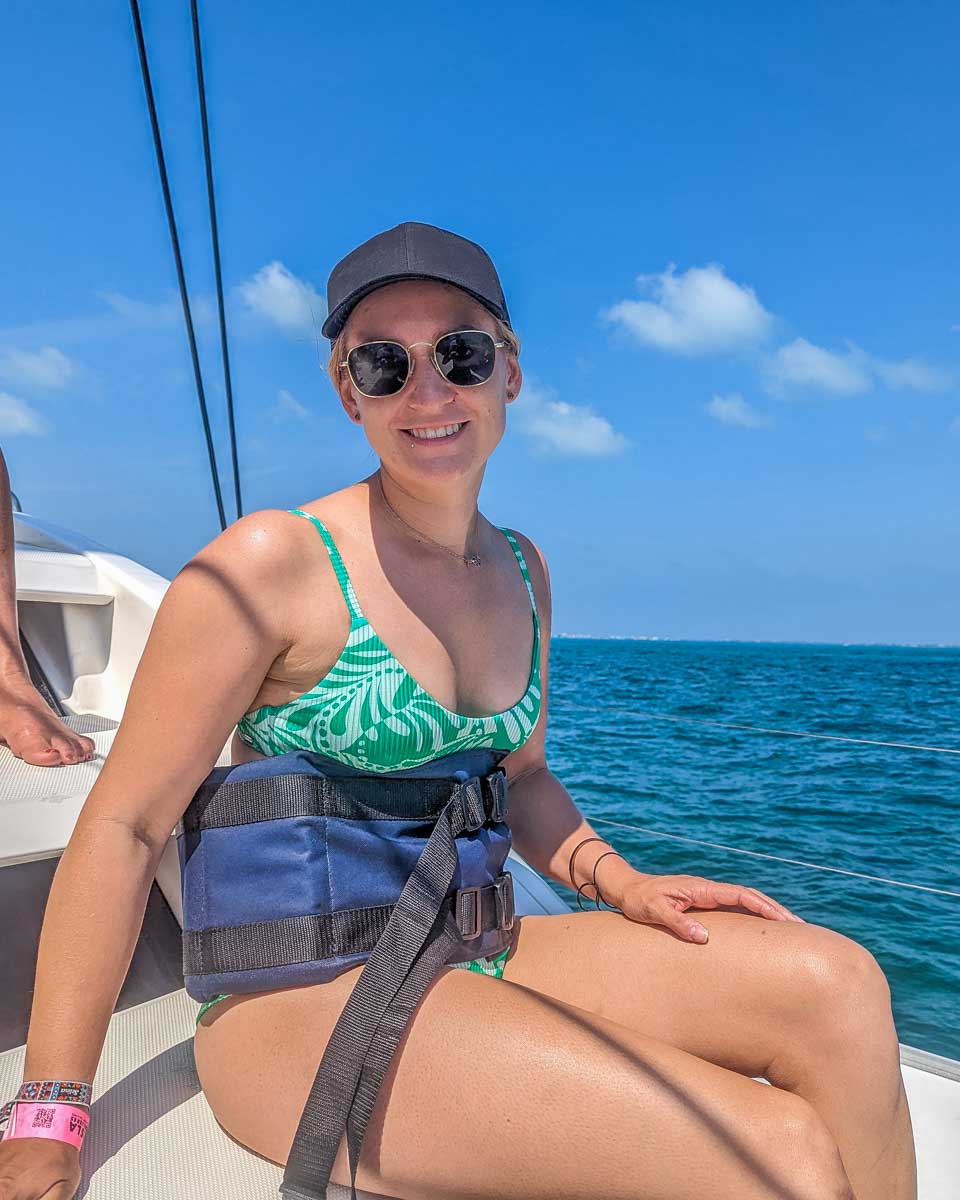 Bailey with a life jacket on a catamaran cruise in CPlaya del Carmen, Mexico before they go snorkeling