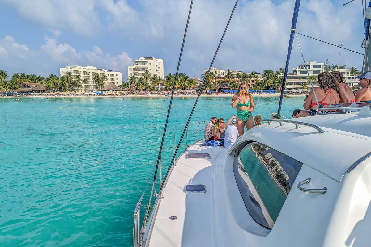 Blue water and a catamaran in Tulum, Mexico