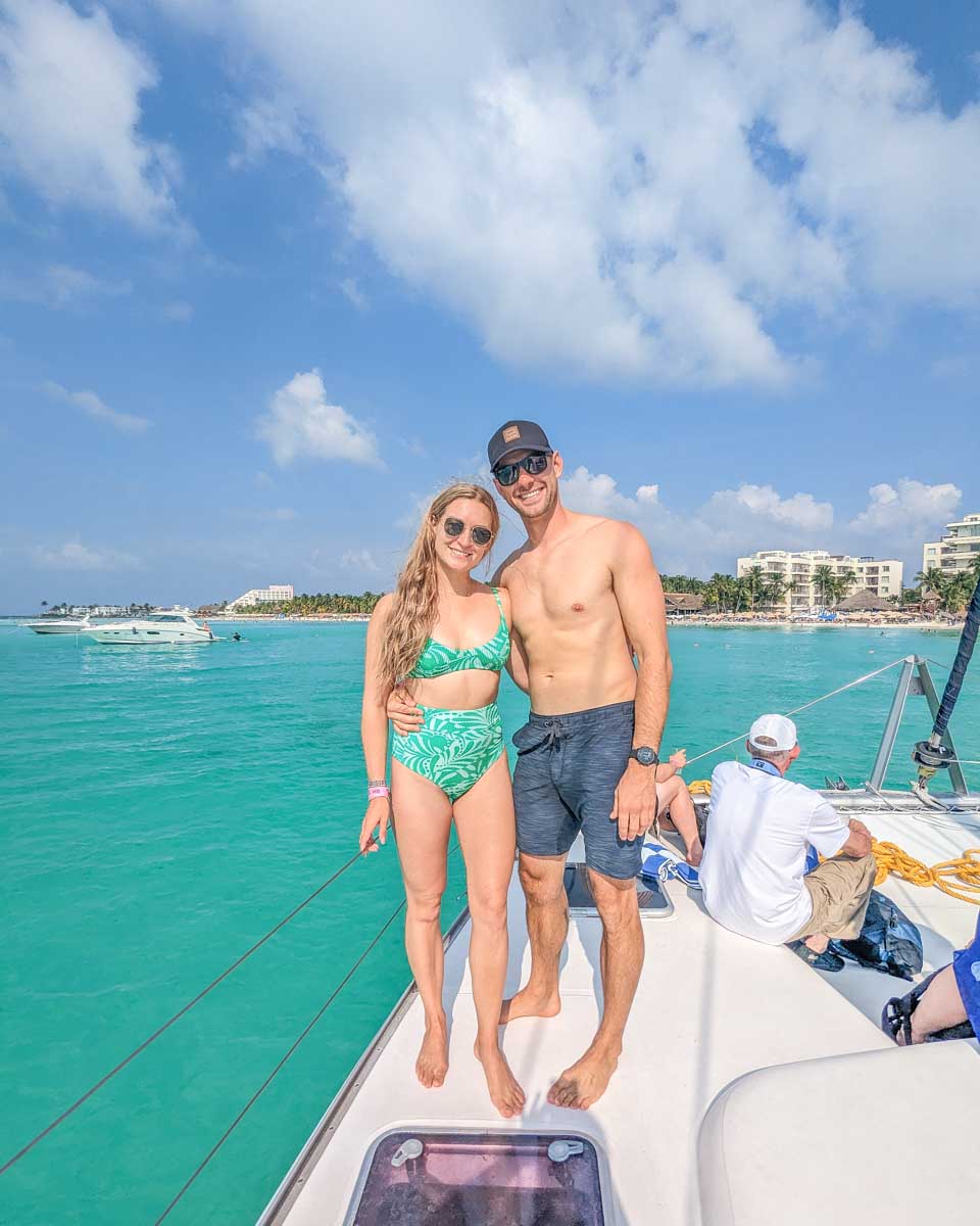 Daniel and Bailey pose for a photo on the end of the catamaran in Playa del Carmen, Mexico