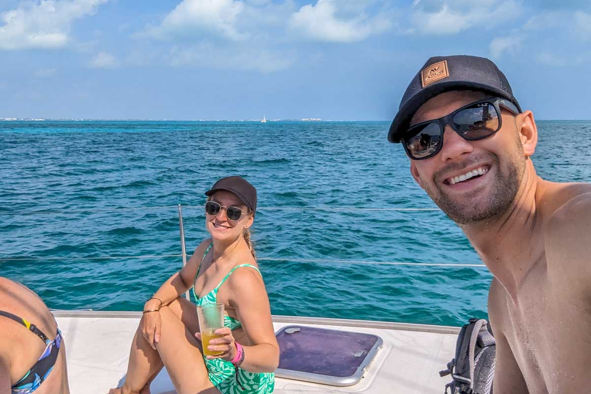 Daniel and Bailey take a selfie on a catamaran tour from Tulum, Mexico