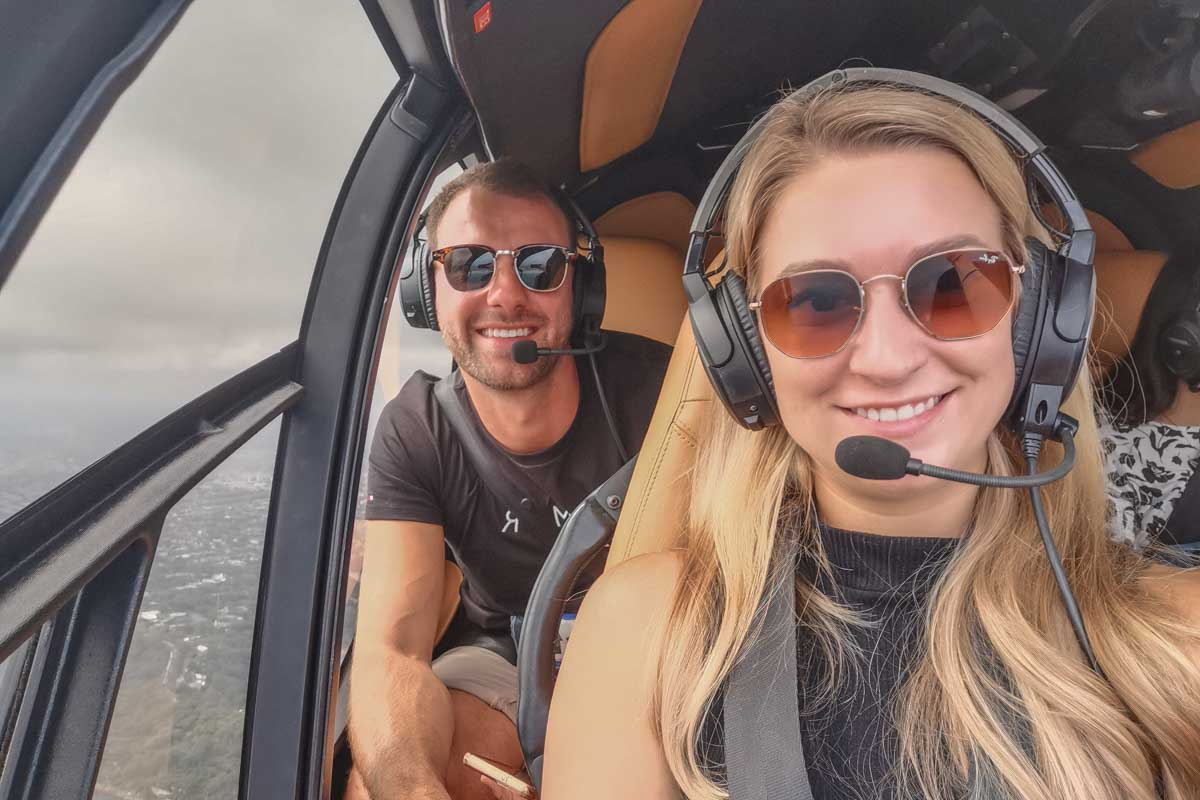 Daniel and Bailey take a selfie on a scenic flight over Sydney