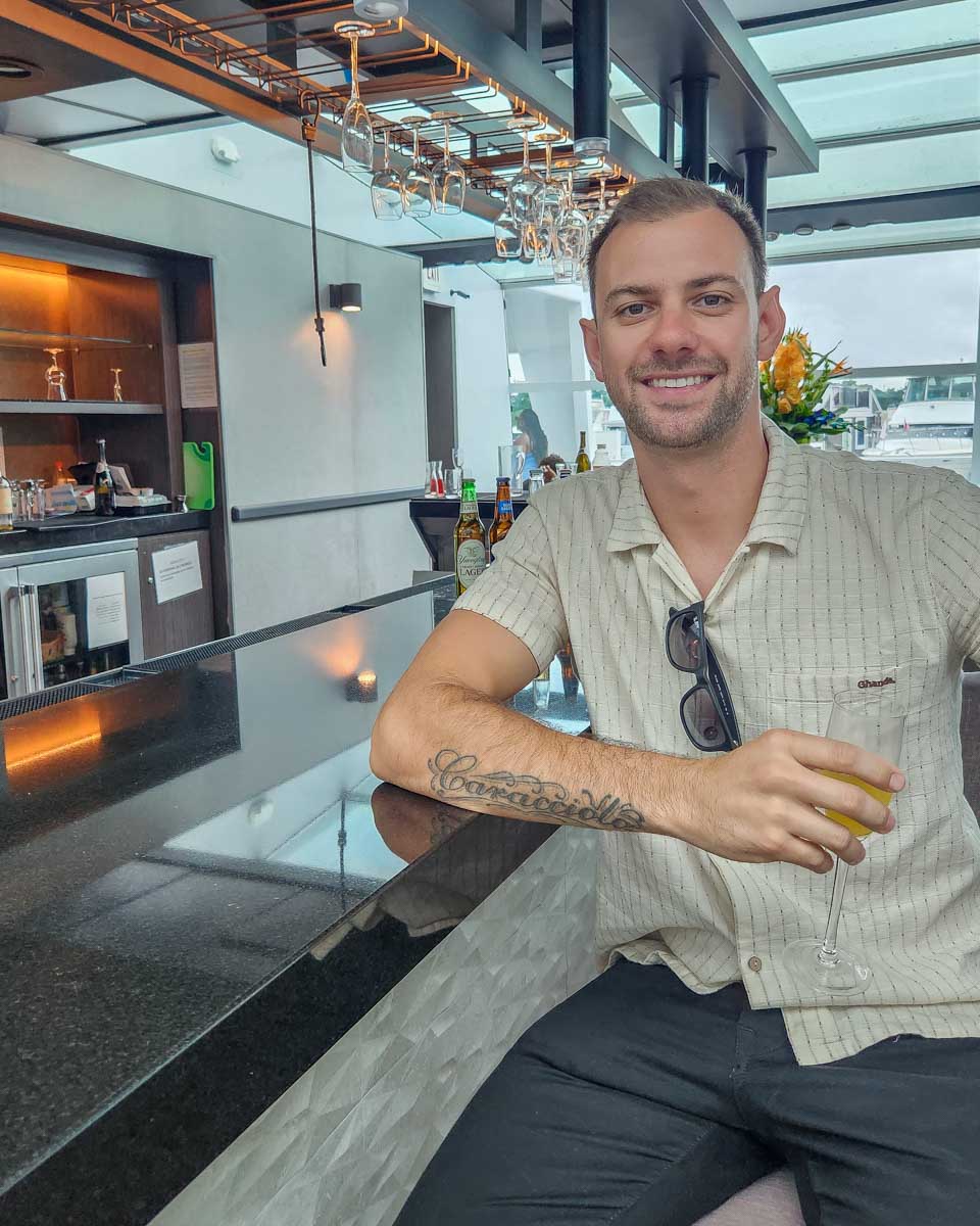 Daniel sits at the bar on a cruise in Washington DC