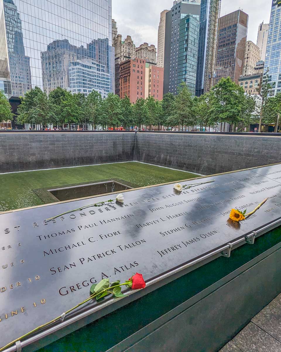Flowers lay on the 911 Memorial in New York City