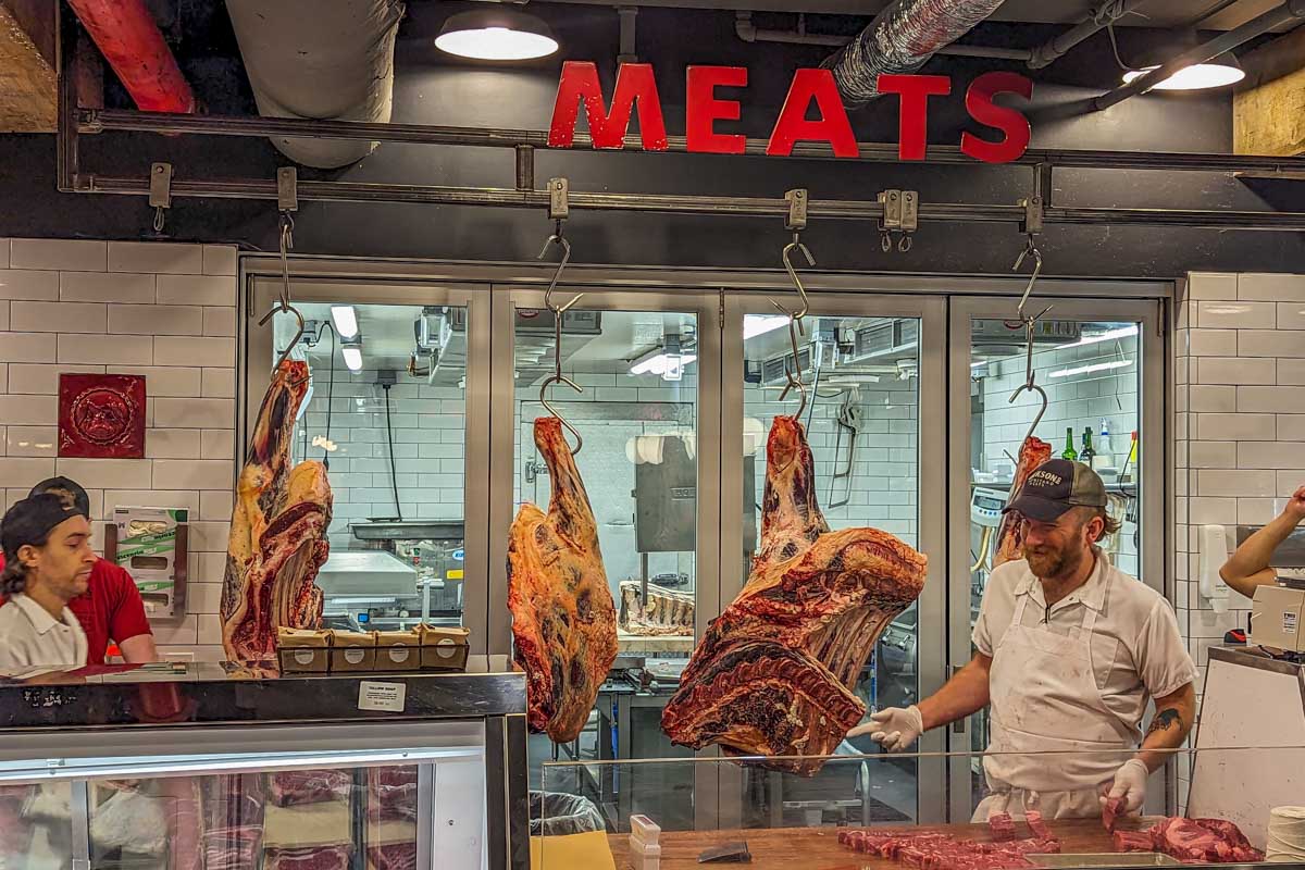 Meat packer inside the Chelsea Market in NYC