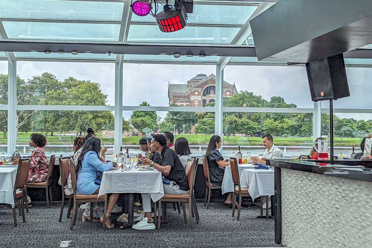 People sit and enjoy their meal on the lunch cruise in Washington DC