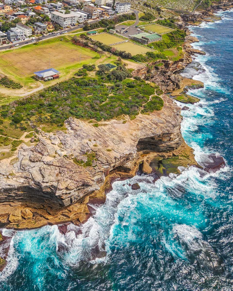 Views of the rocky cliffs of Eastern Sydney as seen from a helicopter flight
