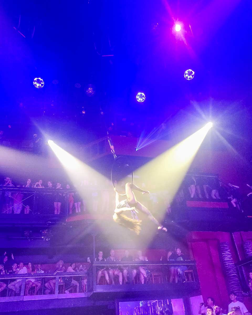 A dancer upside down on a ring at Coco Bongo in Mexico