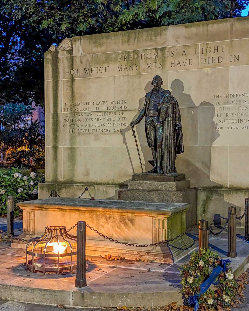 A statue at Washington Square at night on a tour in Philadelphia