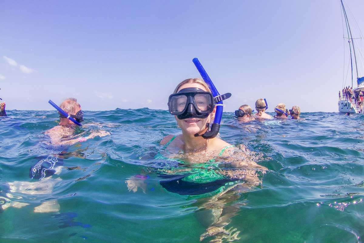 Bailey above the water with a snorkel on during a tour in Tulum