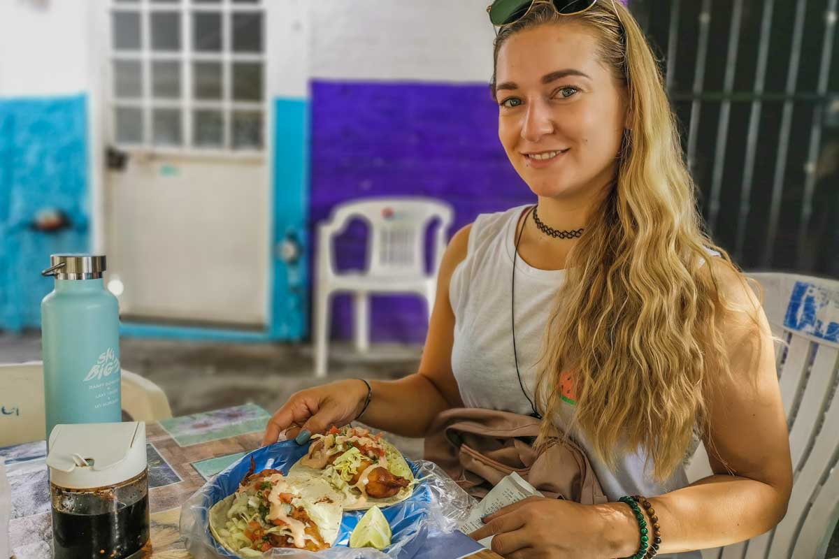 Bailey with a taco on a food tour in Puerto Vallarta, Mexico