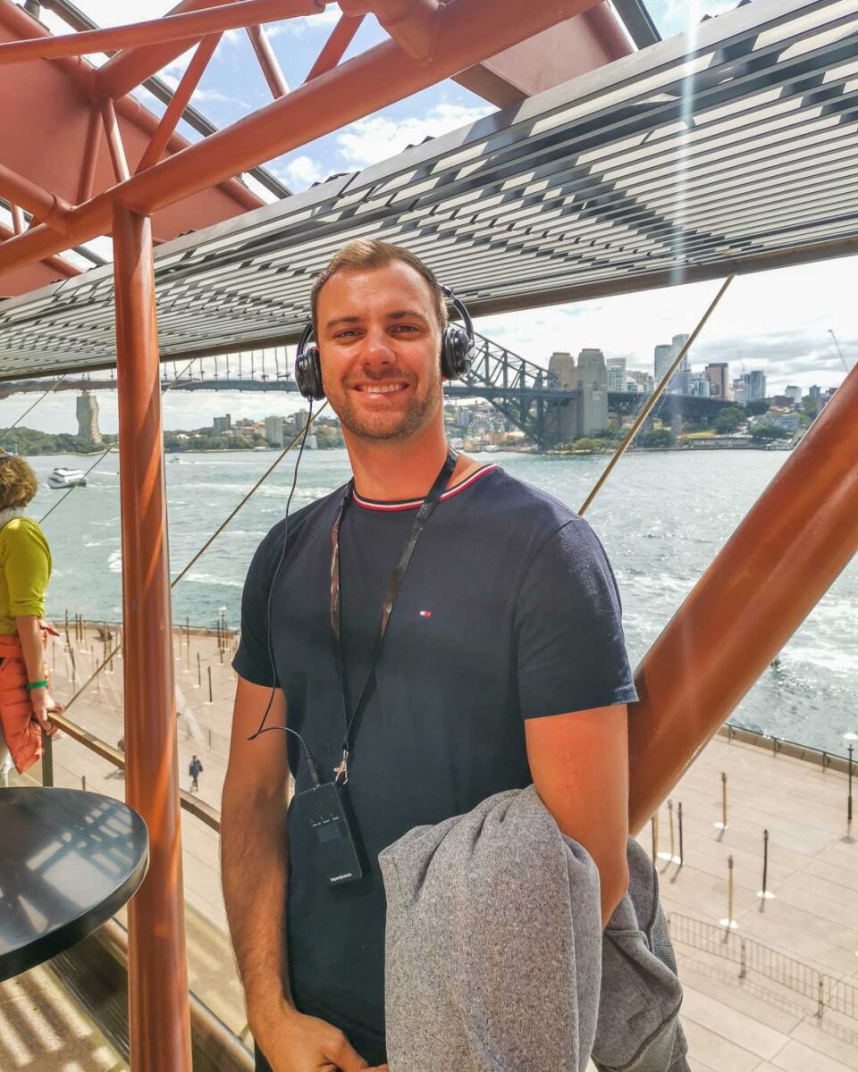 Daniel poses for a photo inside the Sydney Opera House on a tour