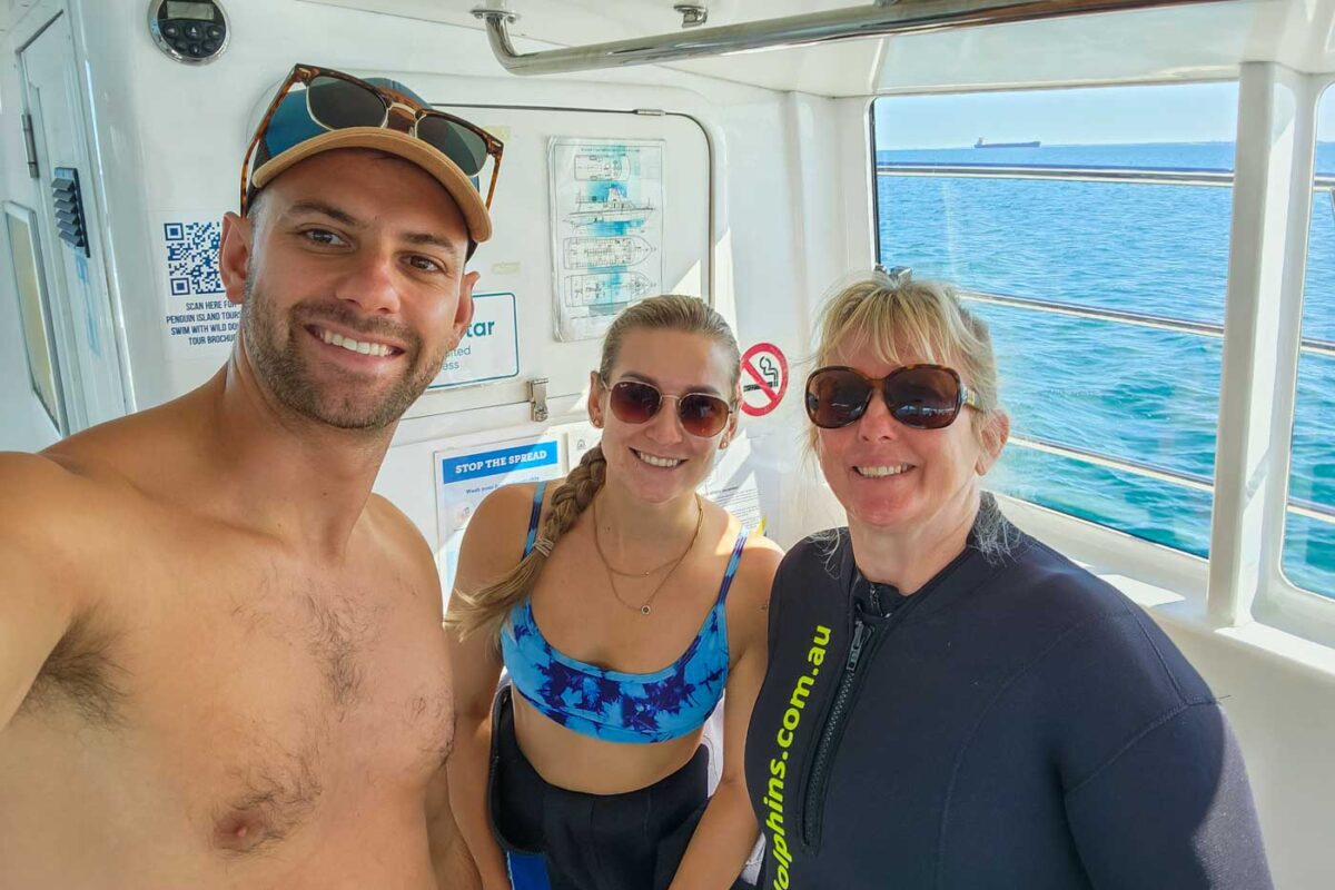 Daniel with bailey and his mum on the dolphin swim in Perth