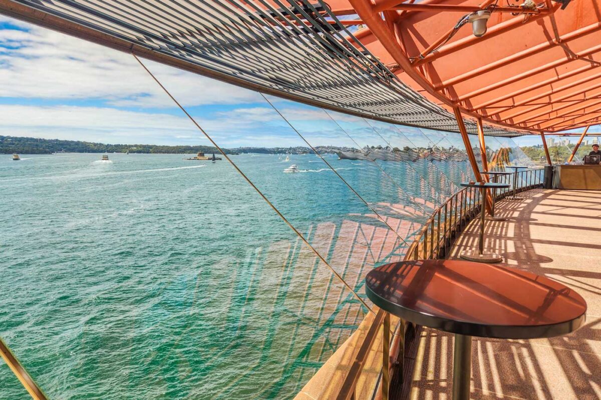Glass windows in the Sydney opera House with views of Sydney harbour