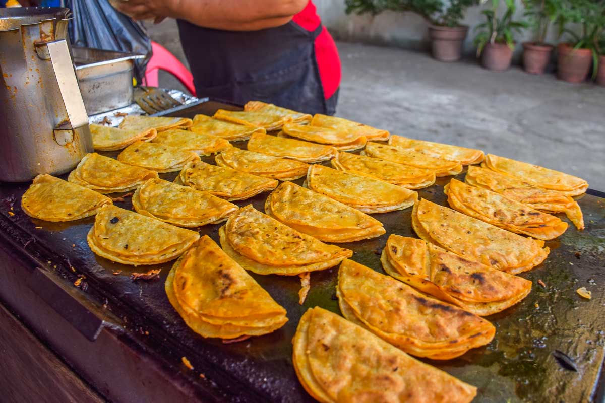 Hard shell tacos being fried in Puerto Vallarta on a food tour