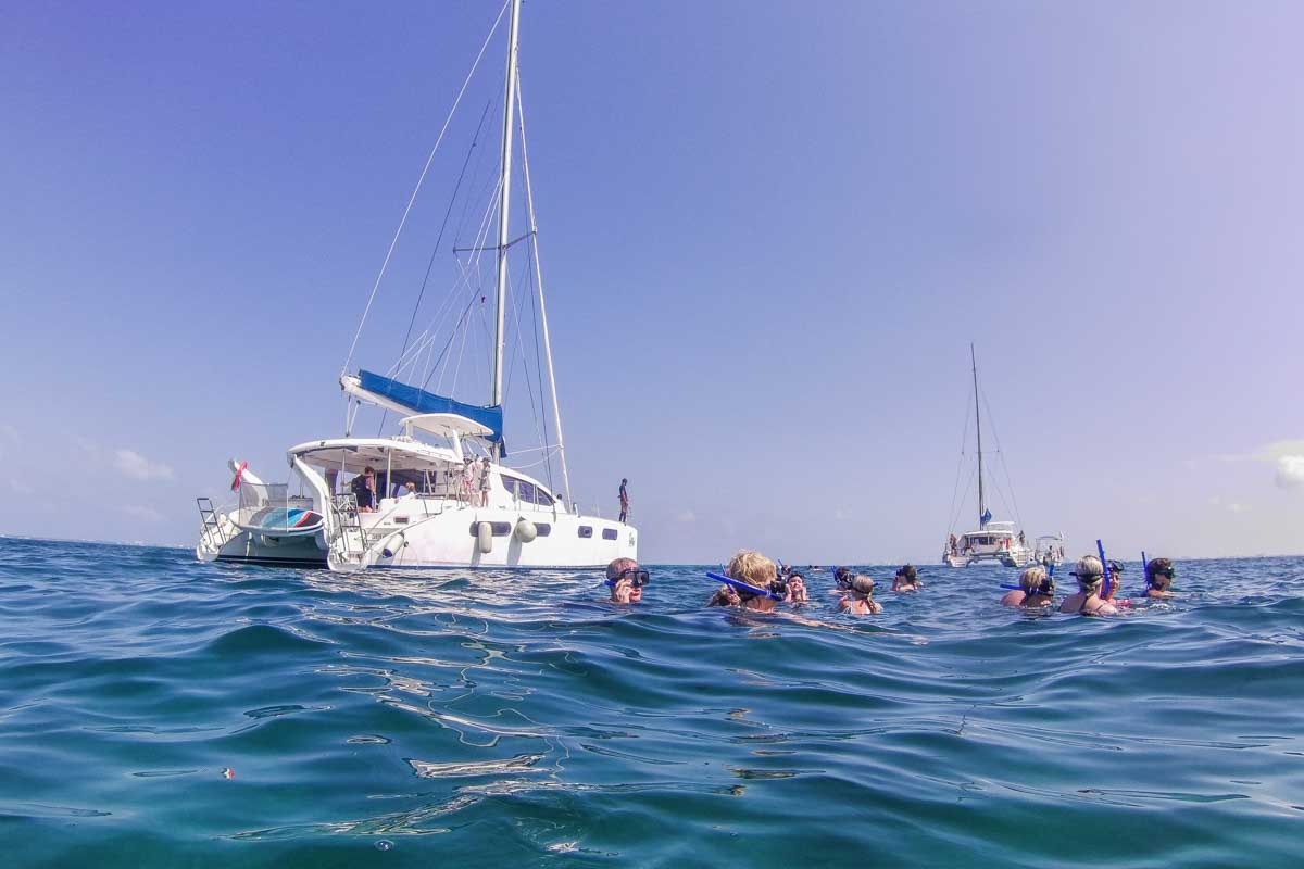 A boat drops a group of snorkelers off in Puerto Morelos, Mexico