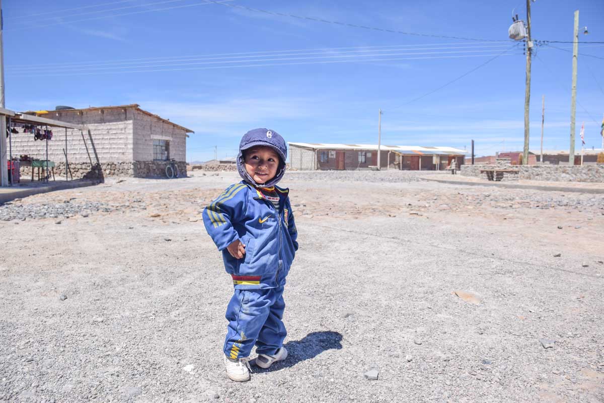A young child at one of the salst mining towns in the Salt Flats of Bolivia
