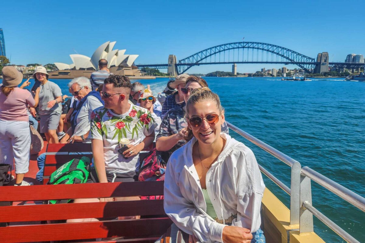 Bailey rides the public ferry from Circular Quay to Manly with views of the Sydney Harbour Bridge and Opera House in the background