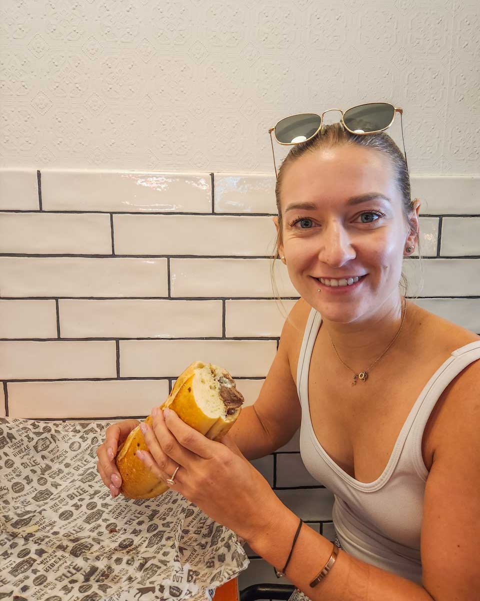 Bailey eats a cheese steak in Philadelphia USA