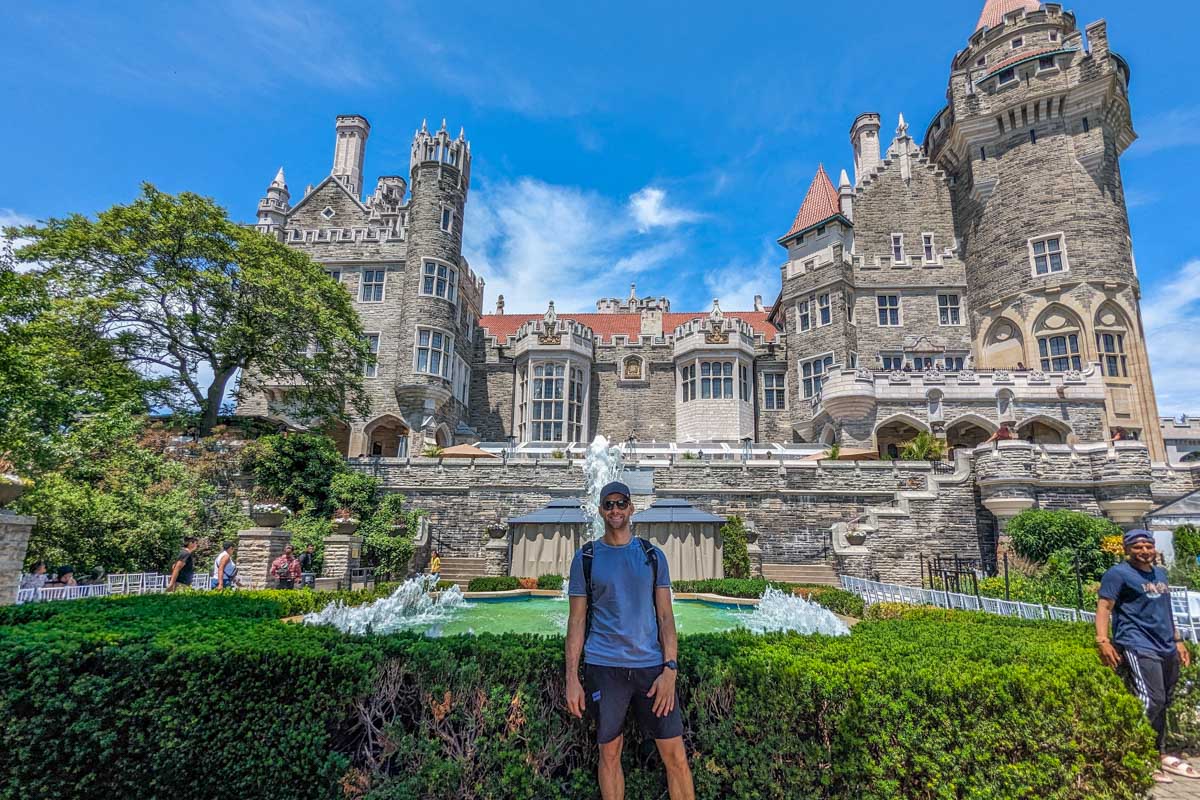 Daniel poses for a photo at Casa Loma in the outdoor garden in Toronto