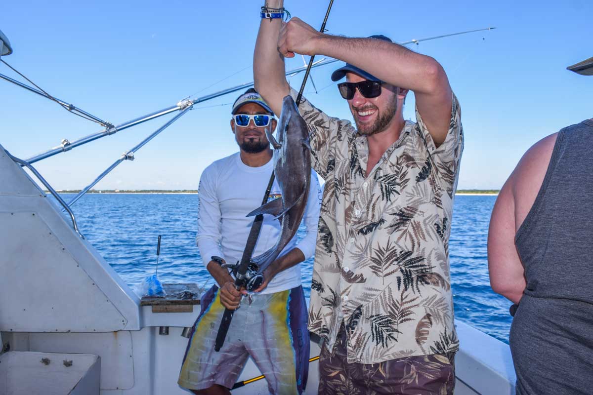 Daniel poses for a photo with a fish he caught in Puerto Vallarta