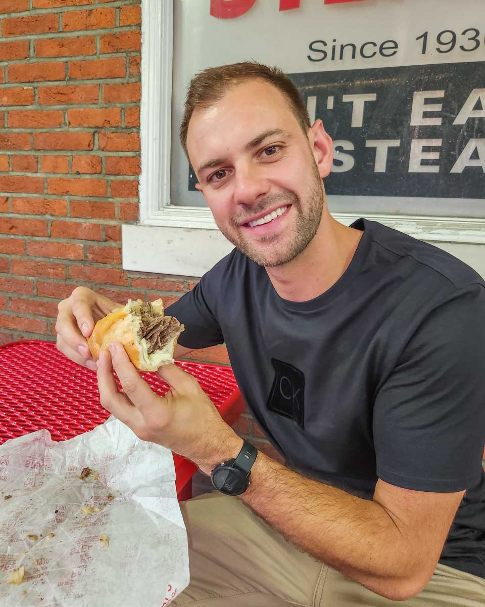 Daniel with a cheese steak from Pat’s King of Steaks