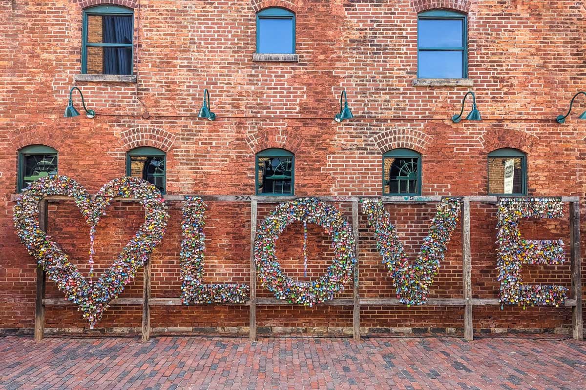 Love sign made of padlocks inside the Toronto Distillery District
