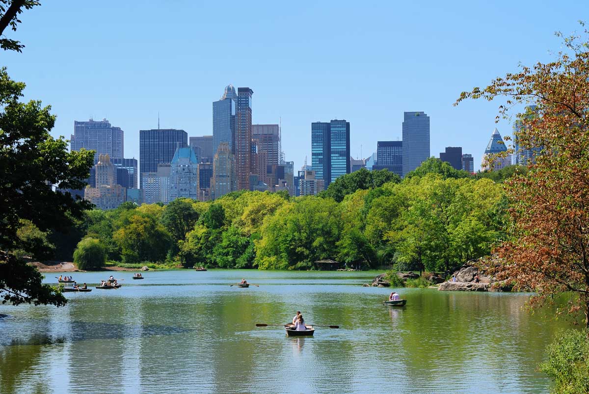 People on boats in the lake inside of Central Park, NYC
