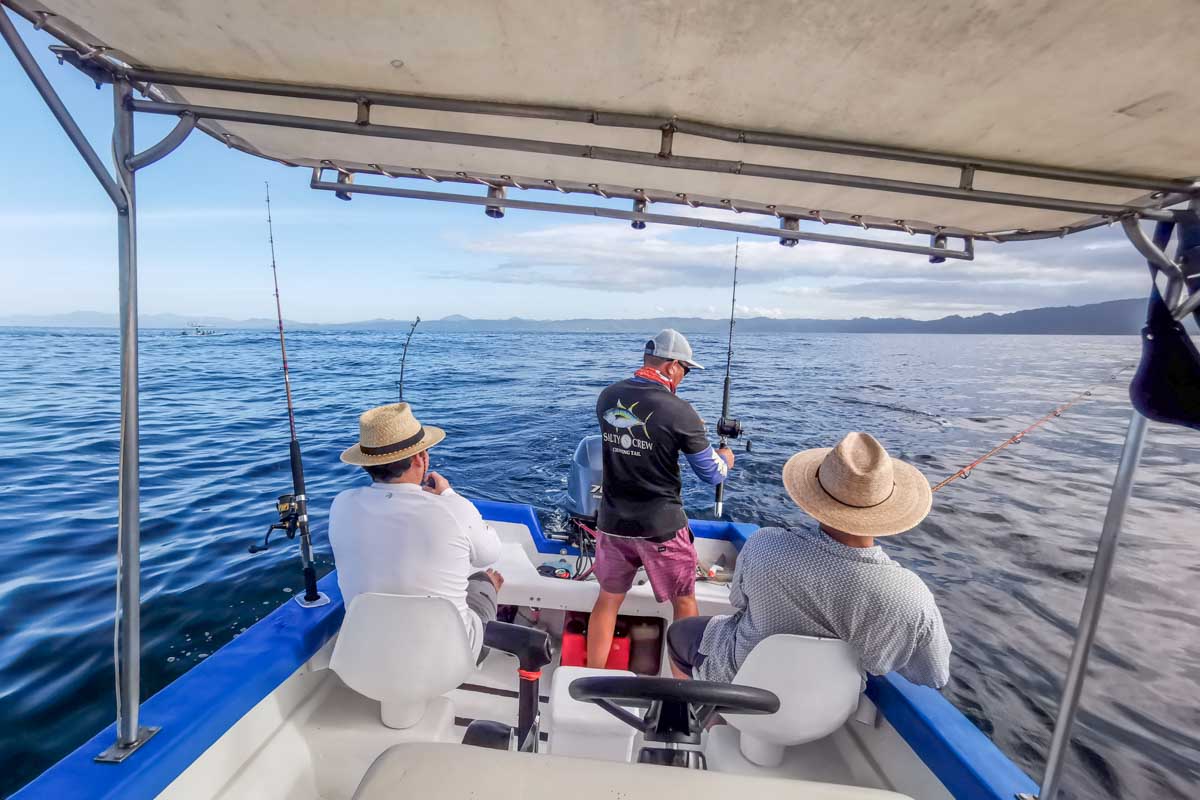 Three people sport fishing in Puerto Vallarta, Mexico