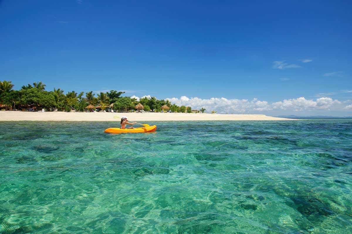 A lady kayaks at South Sea Island, Fiji