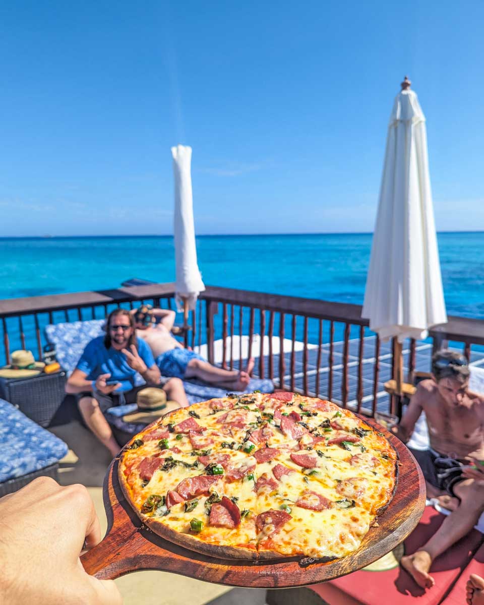 A pizza from the Seventh Heaven Fiji Floating platform with views of the water