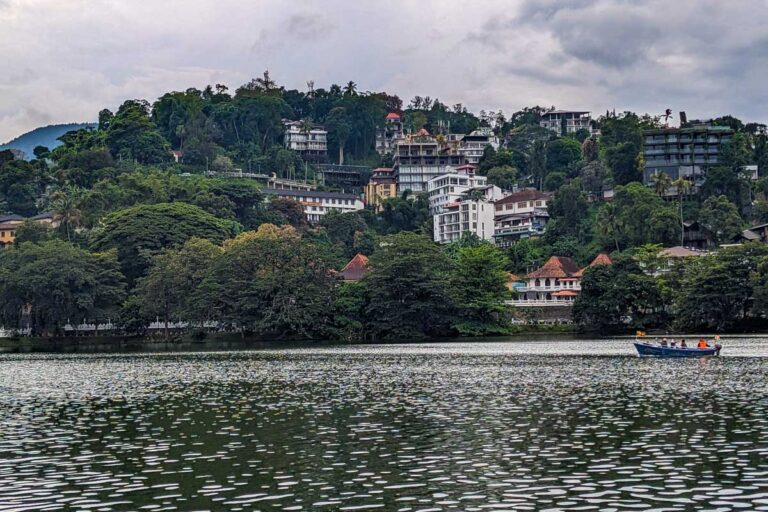 A view of Kandy Lake with mountains in the background Sri Lanka
