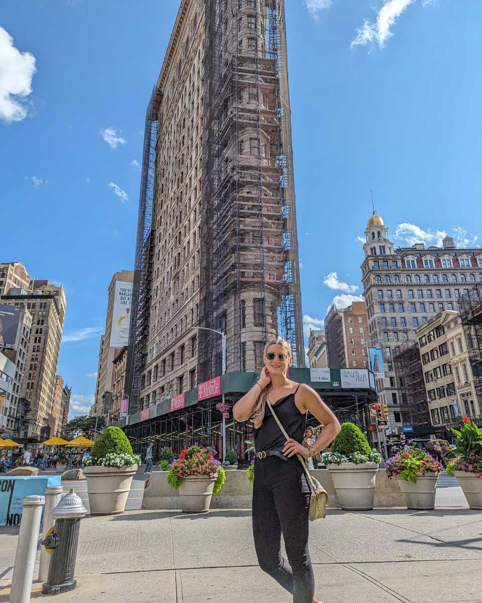 Bailey poses for a photo at the Flatiron Building in NYC