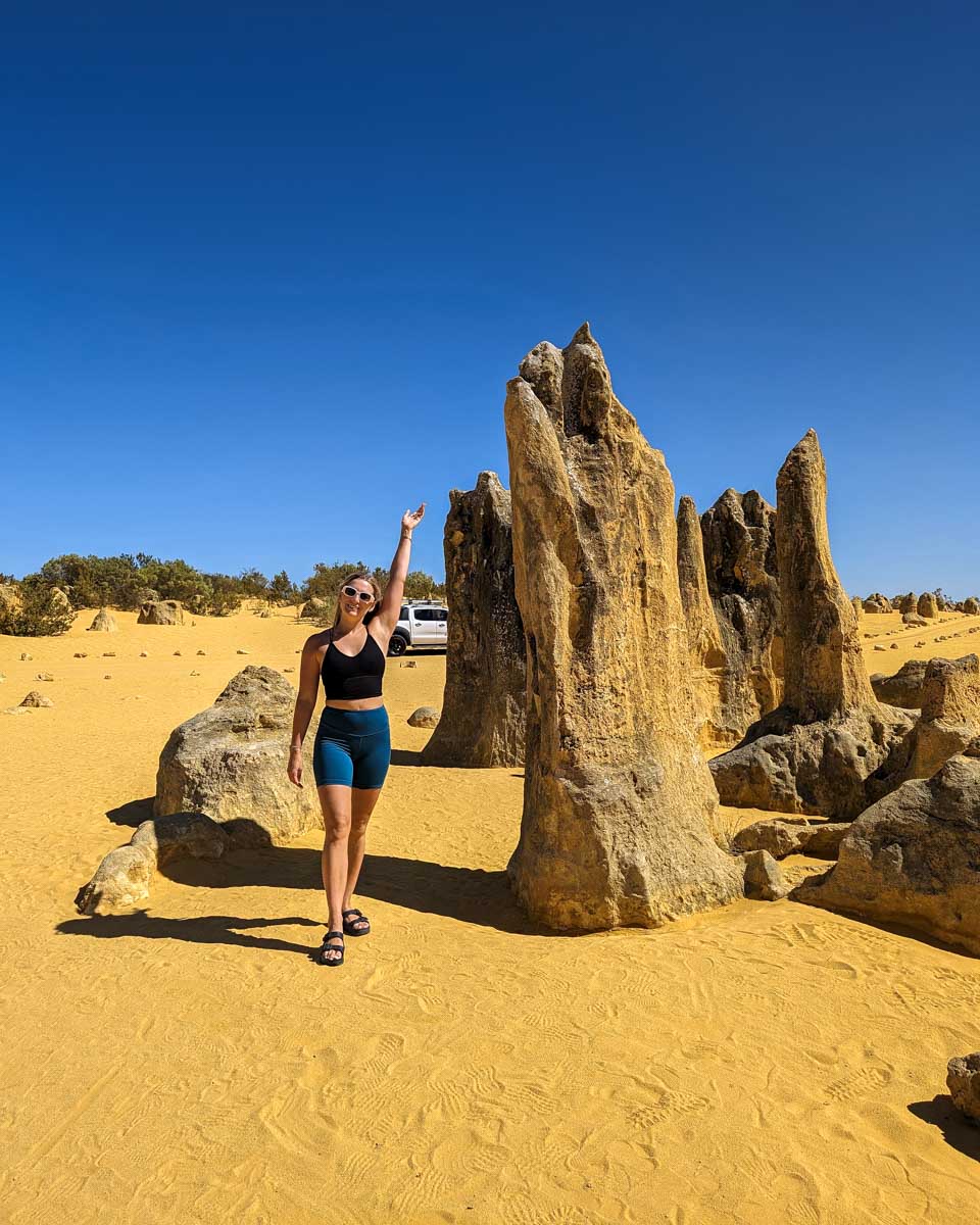 Bailey stands by a pinnacle in Australia