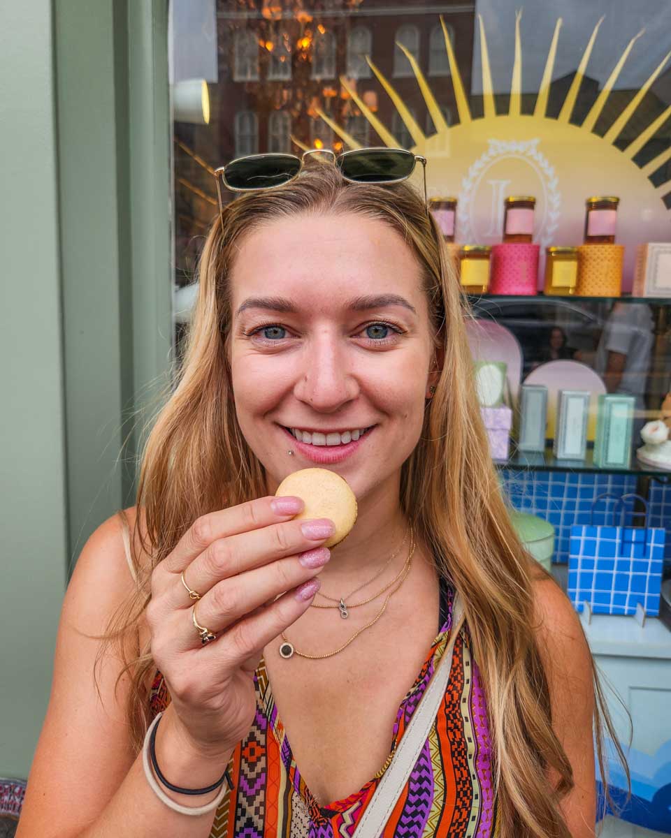 Bailey tastes a macaron from Ladurée in Georgetown Washington DC