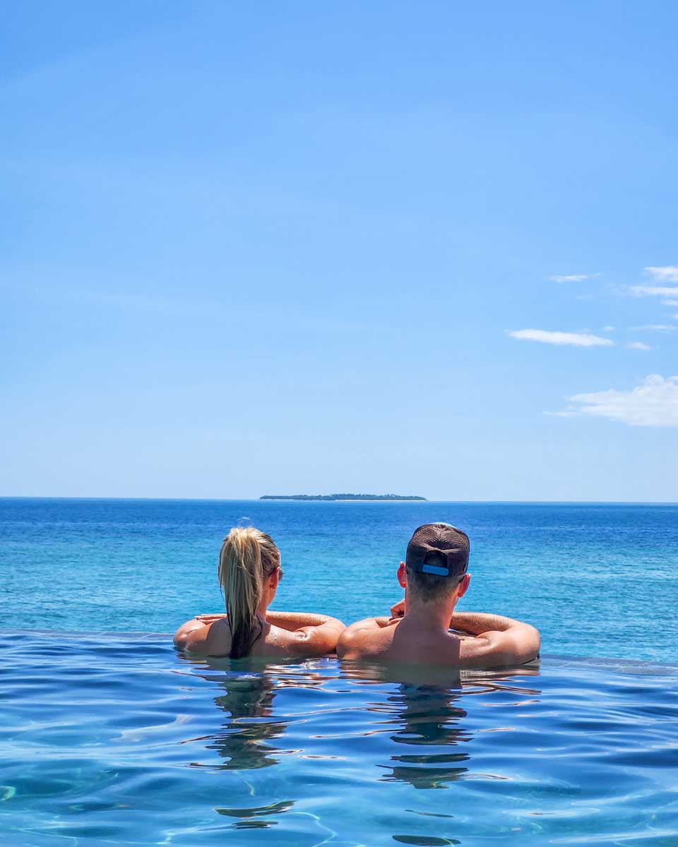 Daniel and Bailey relax in the infinity pool at Malamala Beach Club
