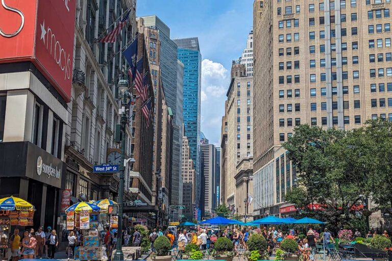 People sit outside during summer in NYC