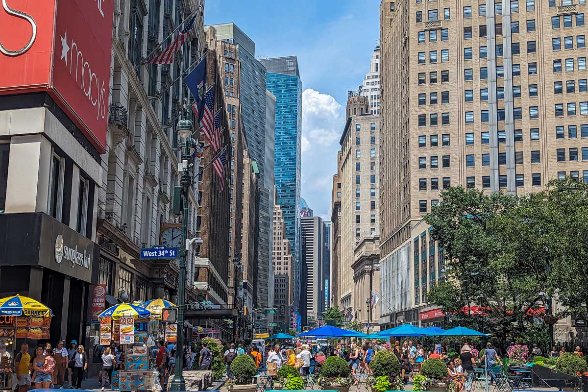 People sit outside during summer in NYC