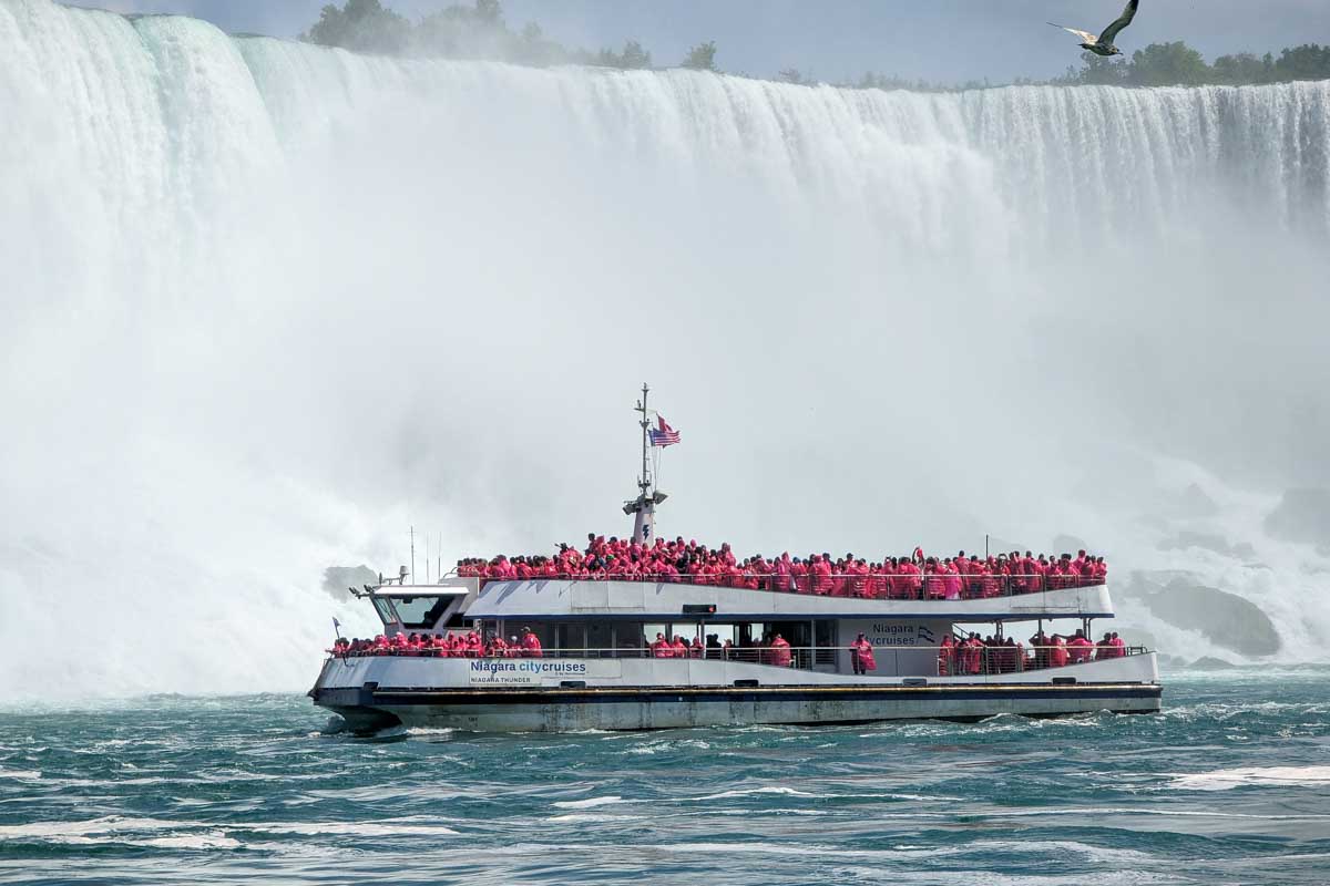 A boat loaded with tourists by niagara falls canada