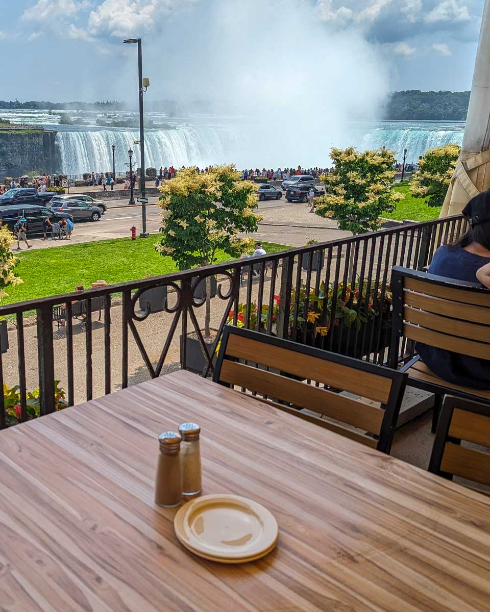 A small table overlooking Niagara Falls at queen victoria palace restaurant canada
