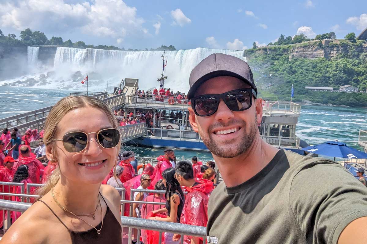 Bailey and Daniel take a selfies as people loading onto a tourist boat at niagara falls canada