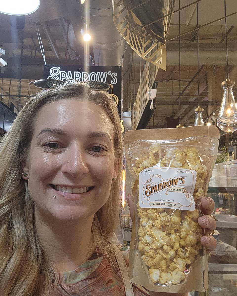 Bailey holding popcorn at Reading Terminal Market Philadelphia