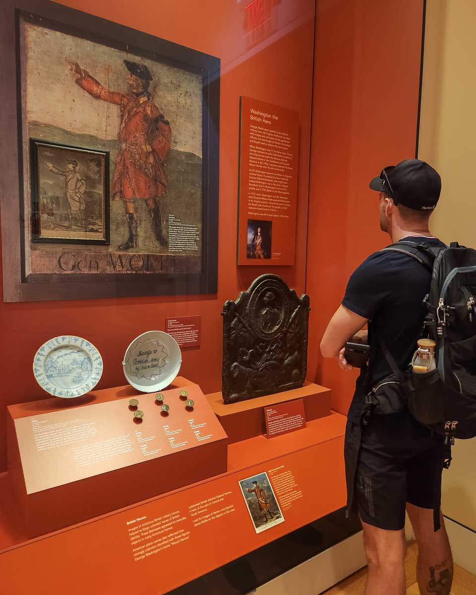 Daniel looks at a display at museum of the american revolution