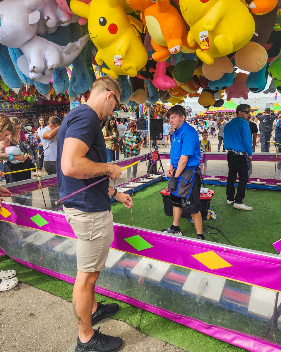 Daniel plays a game at K Days in Edmonton